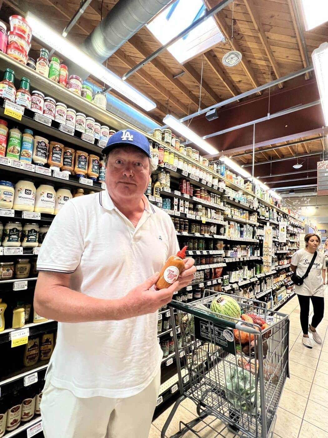Customer holding Tango in the Whole Foods aisle
